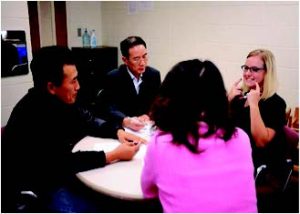 Four people sitting around a table