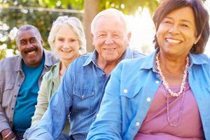 Stock image of four seniors of varying races and genders