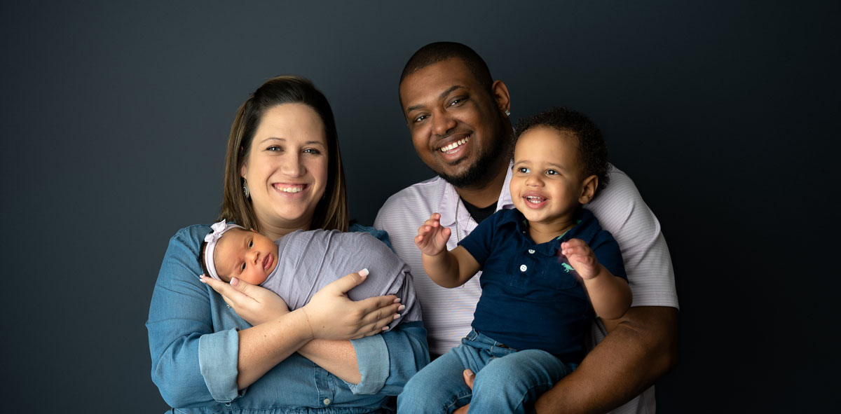 Photo of Donal Buckner and his family: his wife, and two small children