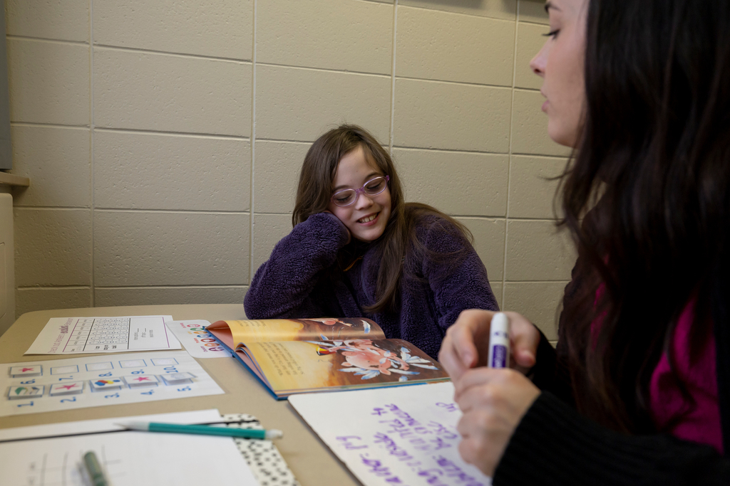 A student works with Ashlee Adams in the MU Speech and Hearing Clinic  in Lewis Hall.