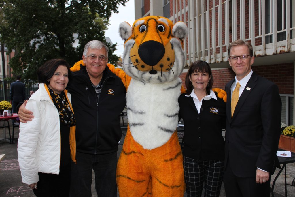 Nancy Toedebusch Fay poses with Elton Fay, Truman the Tiger, Lori Hagglund and CHS Dean Kristofer Hagglund.