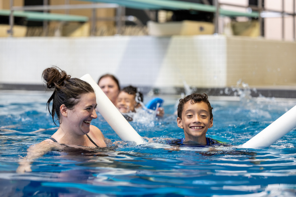 child learning to swim