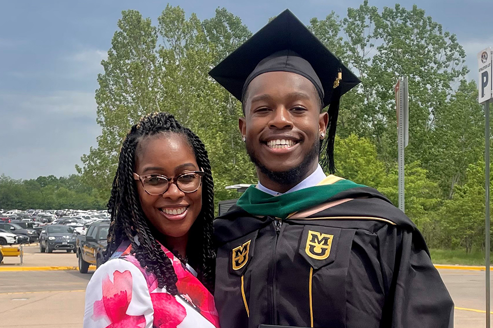 David Gardner poses with his mom after commencement