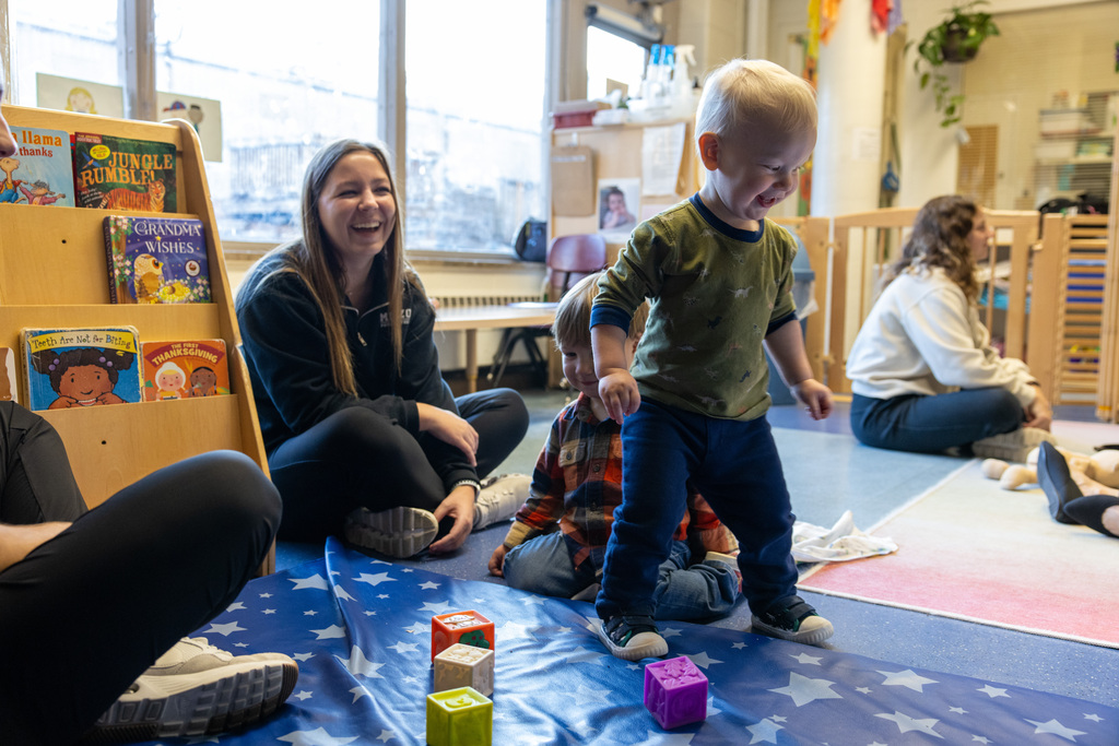 A student observes a toddler in a classroom setting