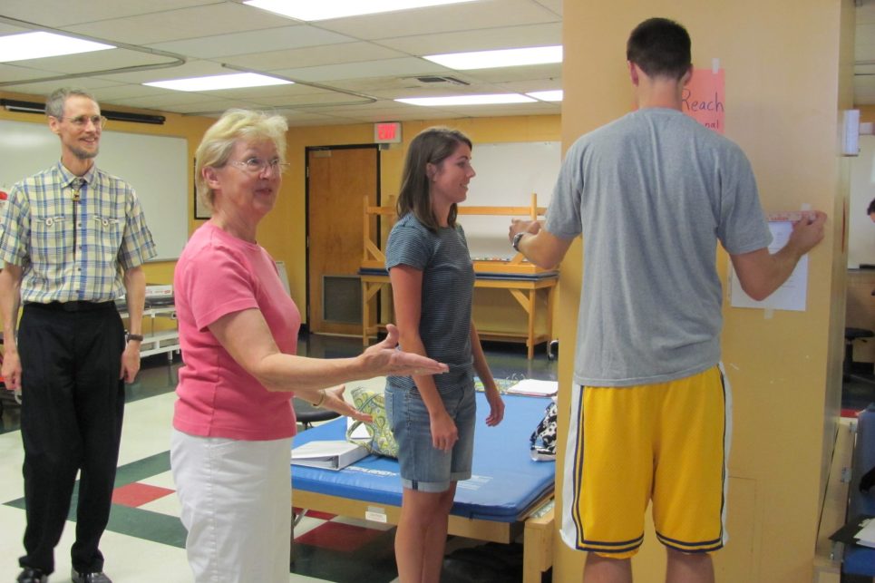 People interact in a physical therapy clinic