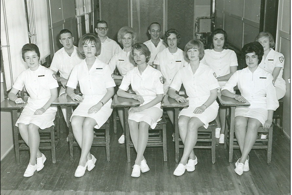 A group of PT students sit at desks