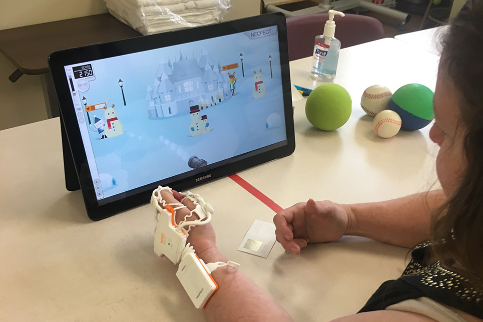 A woman works with a tablet