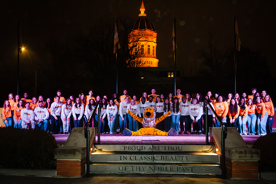 Students pose on Traditions Plaza