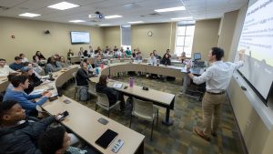 Photo of professor teaching students in classroom
