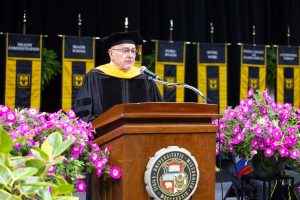 A man speaks at a commencement ceremony