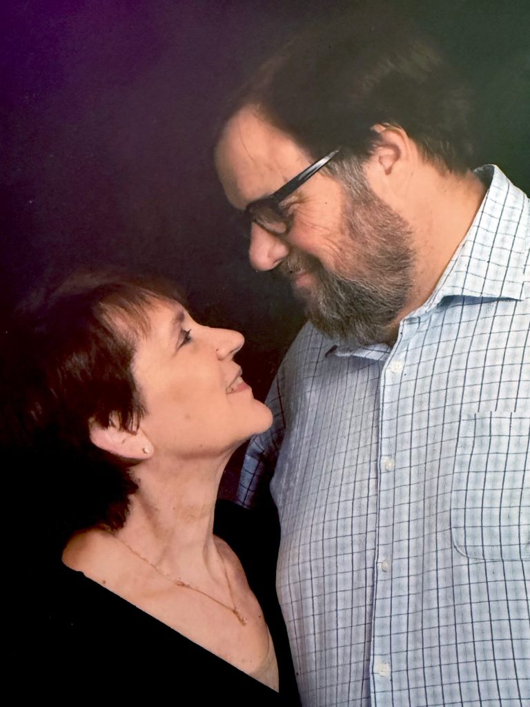 A couple looks at one another